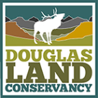 Logo of Douglas Land Conservancy featuring a silhouette of an elk against a backdrop of mountains and colorful landscapes, symbolizing wildlife conservation and land preservation efforts.